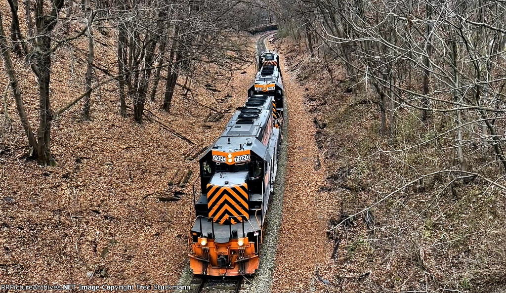 WE 7020 leads the way under Arlington St.